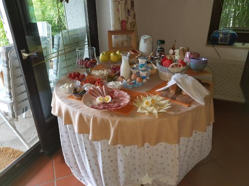 a table with a buffet of food on it at Pr'Simi in Golnik