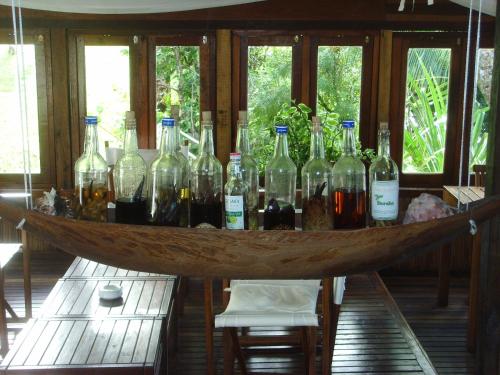 a group of bottles of wine on a table at Boraha Village Ecolodge in Sainte Marie
