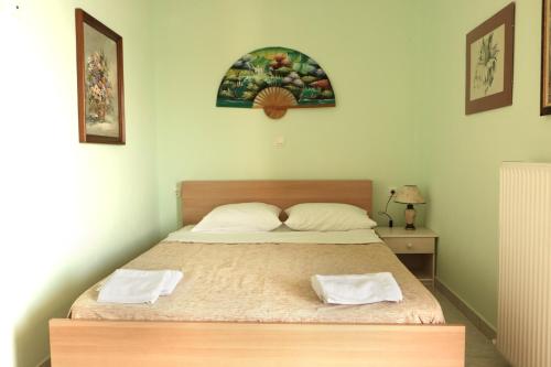 En eller flere senge i et værelse på Aegean Colors