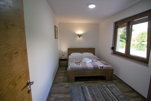 Ένα ή περισσότερα κρεβάτια σε δωμάτιο στο Villa Sabina