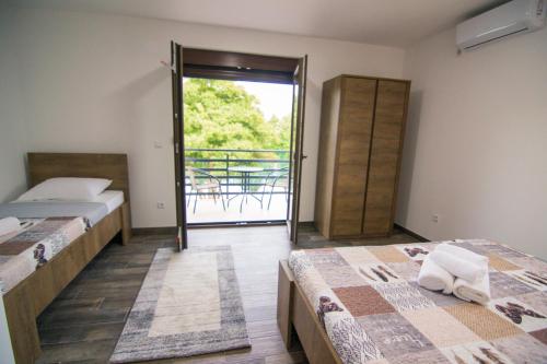 Ένα ή περισσότερα κρεβάτια σε δωμάτιο στο Villa Sabina