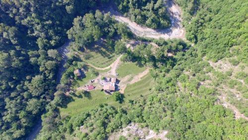 an aerial view of a house in the middle of a forest at Agriturismo di là dall'Acqua in Fivizzano