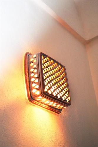 a light on the side of a wall at Horizon Pantelleria in Pantelleria