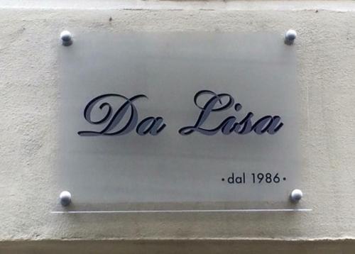 a sign on the side of a building at B&B Da Lisa in Turin