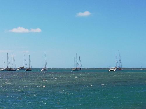 a group of boats floating in the water at Villa Anse Goeland in Rodrigues Island