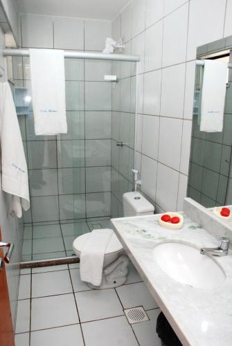 a bathroom with a toilet and a sink at Pousada Costa Marina in Fortaleza