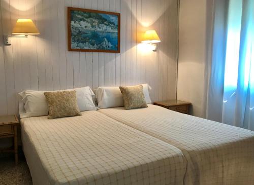 Postel nebo postele na pokoji v ubytování Casa Piscina