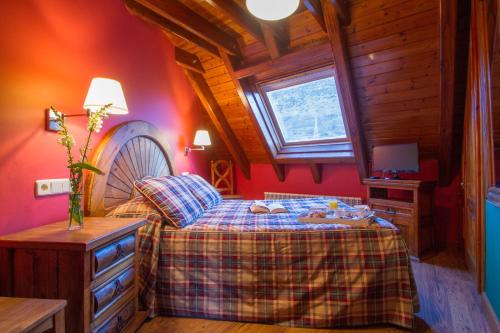 Postel nebo postele na pokoji v ubytování GRAN CHALET Hotel & Petit SPA