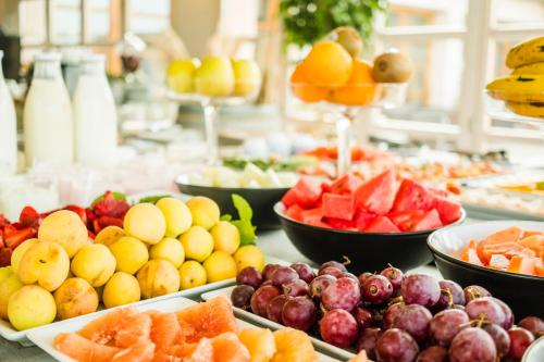 a buffet of fruits and vegetables on a table at Hotel Sa Franquesa Nova in Vilafranca de Bonany