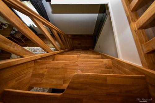 an overhead view of a wooden staircase in a house at B&B De Bloesem in Hoeselt