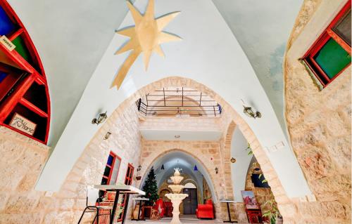 a lobby of a building with a star on the ceiling at Dar Sitti Aziza in Bethlehem