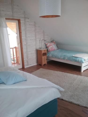 Ένα ή περισσότερα κρεβάτια σε δωμάτιο στο ostseeurlaub-asmussen