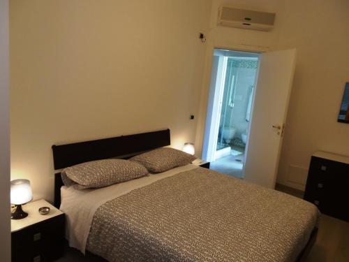 a bedroom with a bed with two pillows on it at Villa Celeste B&B in Pontecagnano