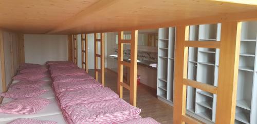 a row of bunk beds in a room at Berghotel Bonistock in Frutt