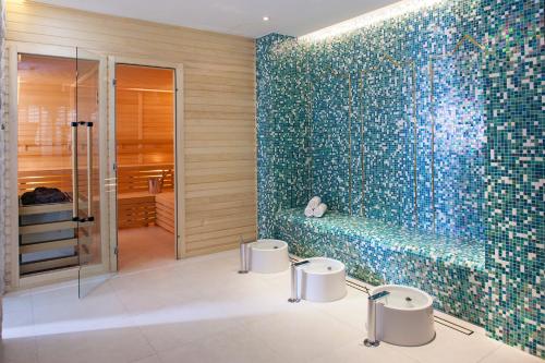 a bathroom with two toilets and a shower at Hapimag Resort Marbella in Marbella