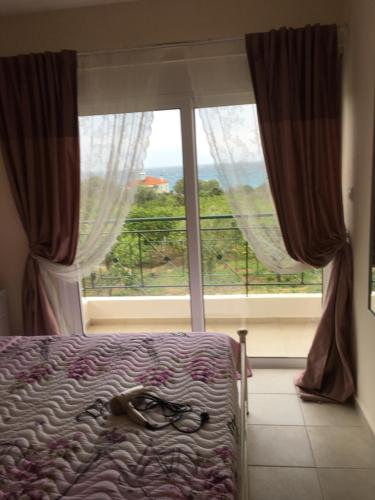 Ένα ή περισσότερα κρεβάτια σε δωμάτιο στο Lovely Appartments Lygia Korinthias