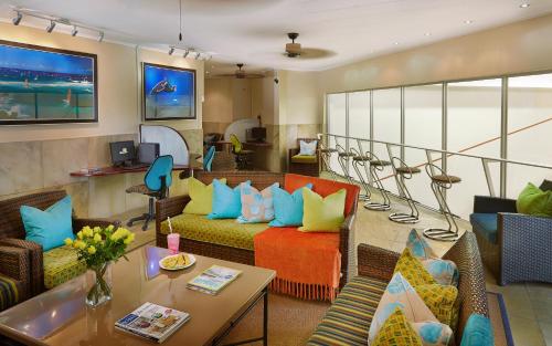 a living room with couches and a table at First Group La Cote D'Azur in Margate