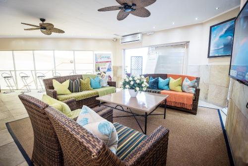a living room with couches and a table at First Group La Cote D'Azur in Margate