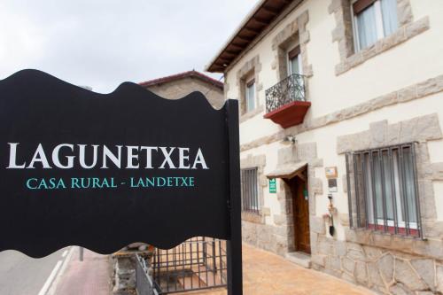 a sign in front of a building at Casa Rural Lagun Etxea in Pobes