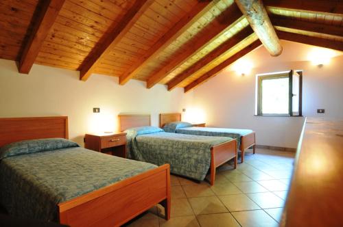 Postel nebo postele na pokoji v ubytování Residence Cirese