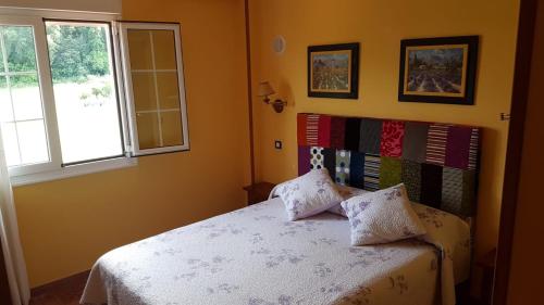 Ένα ή περισσότερα κρεβάτια σε δωμάτιο στο Hosteria Las Viñas