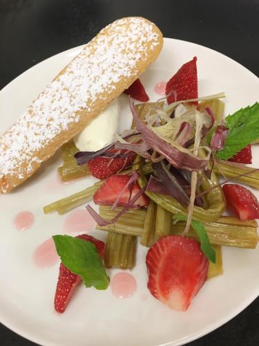 a white plate of food with strawberries and vegetables at Hotel De Bourbon Grand Hotel Mercure Bourges in Bourges