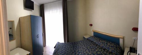 Postel nebo postele na pokoji v ubytování Hotel Sirena