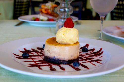 a dessert on a white plate on a table at Hotel Costa Brava in Manzanillo