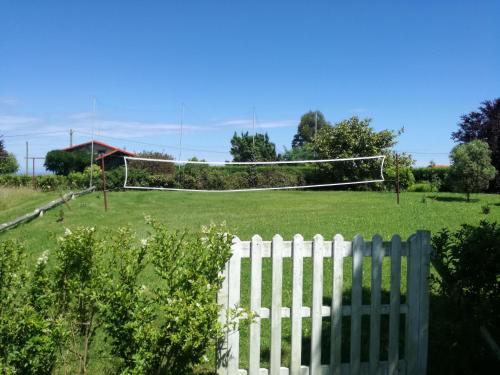 a white fence in a field with a goal at Casa El Prado de la Romia in Argüero