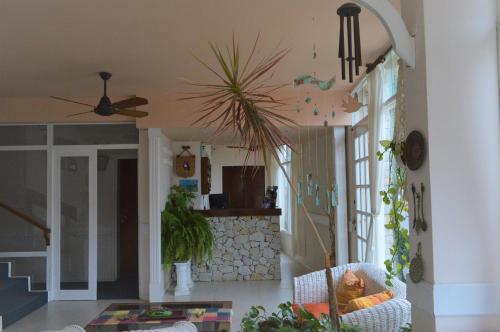 a living room with a couch and a table at Tamanacos Hotel & Spa in Villa Gesell