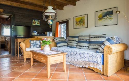 a living room with a couch and a table at Kitzecker-Weingartenhaus in Kitzeck im Sausal