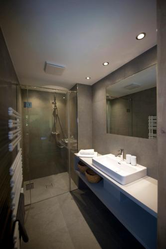 a bathroom with a sink and a shower at Pension Baldauf - Dorf 31 in Kleinarl