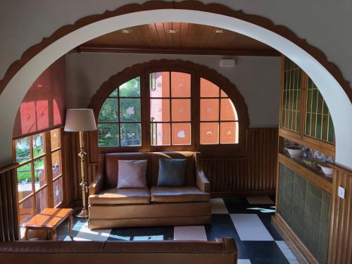 an archway in a living room with a couch at Hostal de la Gloria in Viladrau