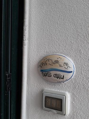 a button with a picture of a city on a door at CETARA - ALBERGO DIFFUSO in Cetara