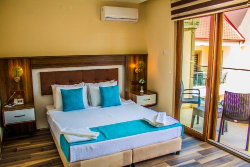 Postel nebo postele na pokoji v ubytování Form Thermal Hotel & SPA Kaz Dağları