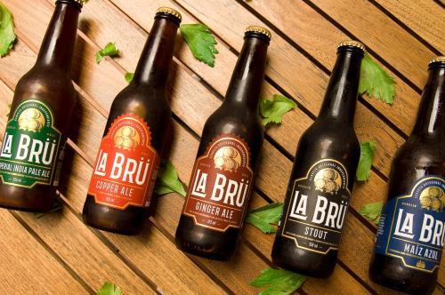 a group of bottles of beer on a wooden table at Hotel Casino Morelia in Morelia