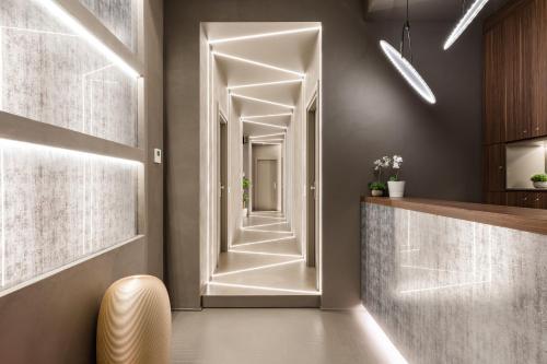 a hallway with a door leading into a room at A World Aparts - Barberini Boutique Hotel in Rome