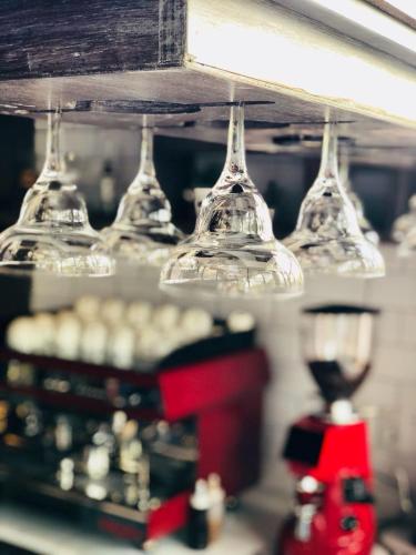 a row of wine glasses sitting on top of a counter at Five Hotel & Residences in Asuncion