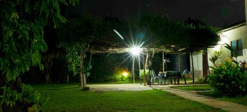 a house with a light on top of it at night at Wli Water Heights Hotel in Wli Afegame