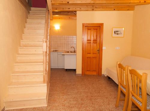 a staircase in a room with a kitchen and a table at Villa Visnjan Residence 2 in Višnjan