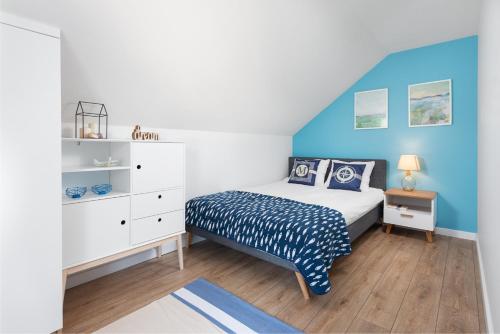 Postel nebo postele na pokoji v ubytování ApartDomek7b Jasne Wybrzeże - nowy i luksusowy