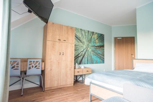 Cama o camas de una habitación en Dom Wypoczynkowy Simurg