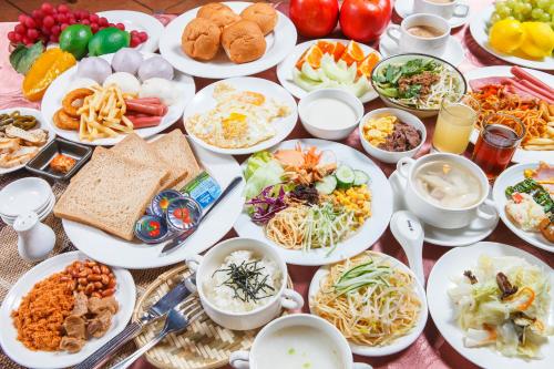 a table full of plates of food on a table at Wei-Yat Grand Hotel in Tainan