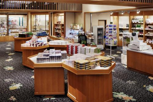 a store with several counters filled with products at Fujikawaguchiko Onsen Konanso in Fujikawaguchiko