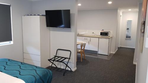 Kuchyň nebo kuchyňský kout v ubytování Wynnum Anchor Motel