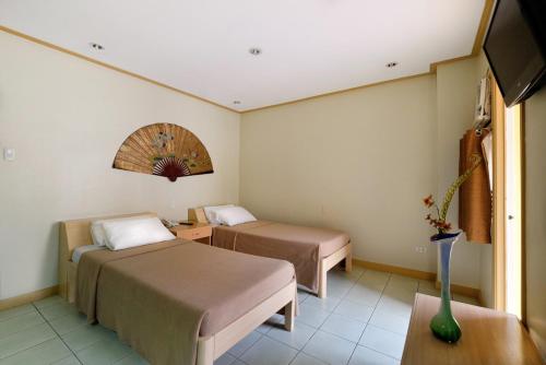 Llit o llits en una habitació de Casa Rosario Hotel