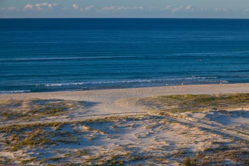 an aerial view of a beach with the ocean at Meridian Tower Kirra Beach in Gold Coast