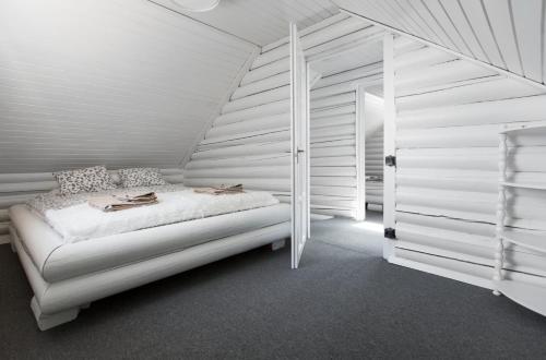 מיטה או מיטות בחדר ב-Öböl Liget vendégházak