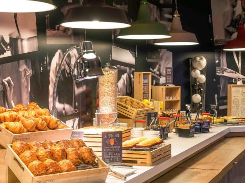 a bakery with various types of bread and pastries at ibis Deauville Centre in Deauville