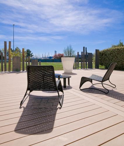 two chairs and a table on a patio at Hotel le Crouesty in Arzon